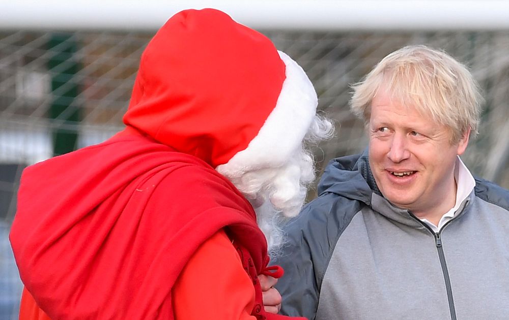 Britainu00e2u20acu2122s Prime Minister Boris Johnson talks with a man dressed as Santa Claus, as he campaigns in Cheadle Hulme, Britain December 7, 2019. u00e2u20acu201d Reuters pic