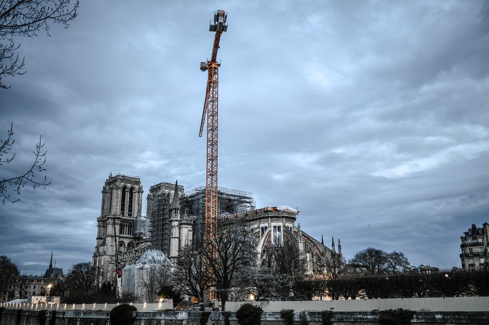 A picture taken on December 26, 2019 shows a giant crane outside the Notre-Dame Cathedral in Paris, which was partially destroyed when fire broke out beneath the roof on April 15, 2019. u00e2u20acu201d AFP pic 