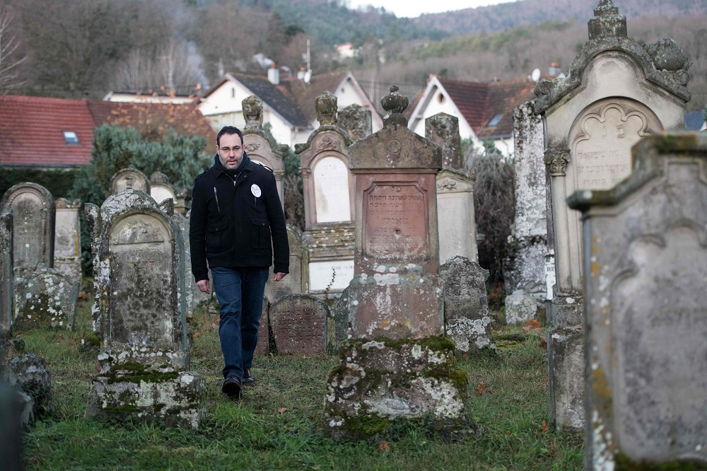 Volunteer u00e2u20acu02dcmemory watcheru00e2u20acu2122 Lionel Godmet patrols in the Jewish cemetery in Jungholtz, eastern France December 10, 2019. u00e2u20acu201d AFP pic 
