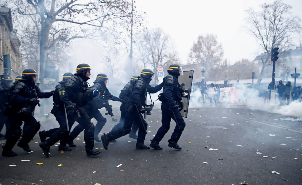 French CRS riot police charge during clashes with protestors at a demonstration against French governmentu00e2u20acu2122s pensions reform plans in Paris as part of a day of national strike and protests in France, December 5, 2019. u00e2u20acu201d Reuters pic 