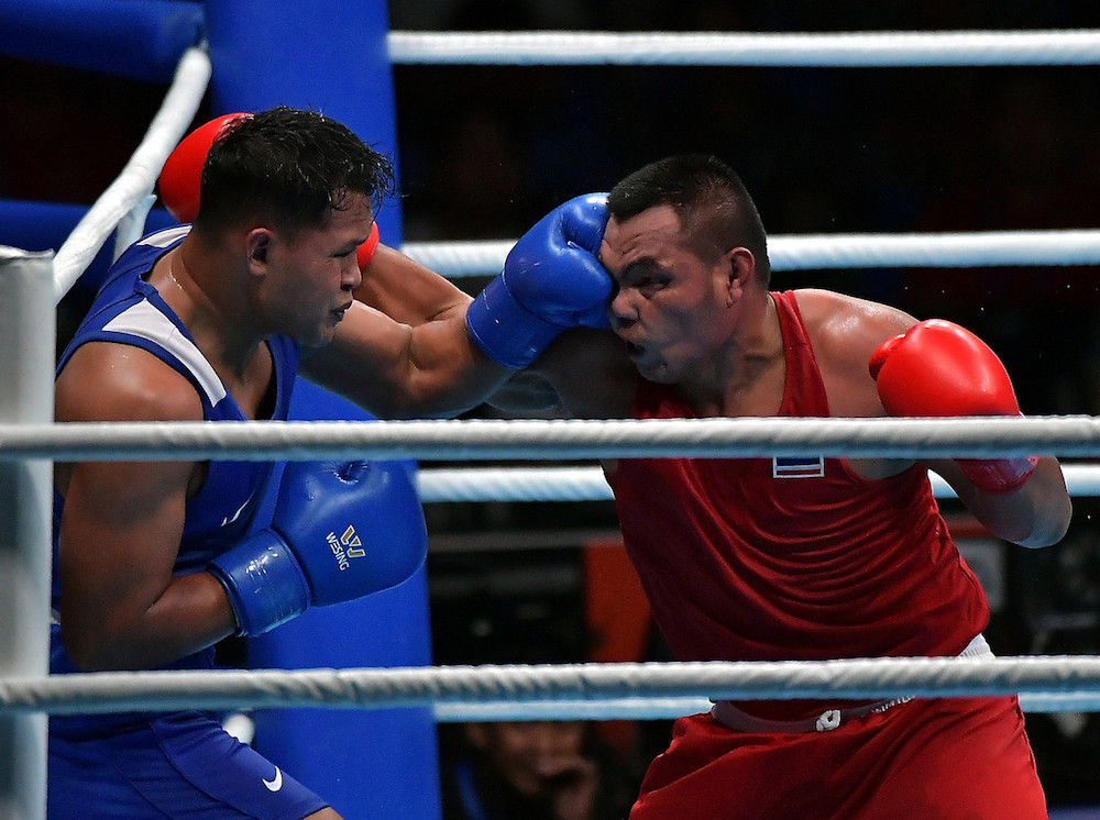 Malaysiau00e2u20acu2122s Khir Akyazlan Azmi (left) in action with Thailandu00e2u20acu2122s Thongkrathok Anavat during the light heavyweight under 81kg semi-final at the 30th SEA Games in Manila December 8, 2019. u00e2u20acu201d Bernama pic