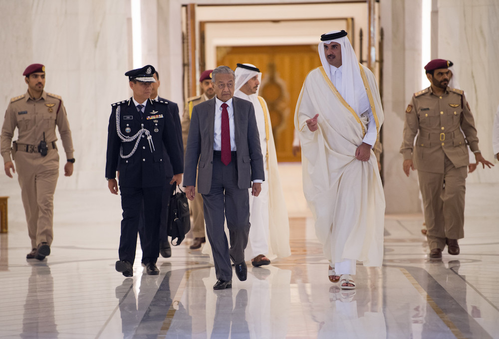 Prime Minister Tun Dr Mahathir Mohamad with Emir of Qatar Sheikh Tamim bin Hamad Al Thani during an official welcoming ceremony in Doha December 12, 2019, in conjunction with his four-day official visit to Qatar. u00e2u20acu201d Bernama pic