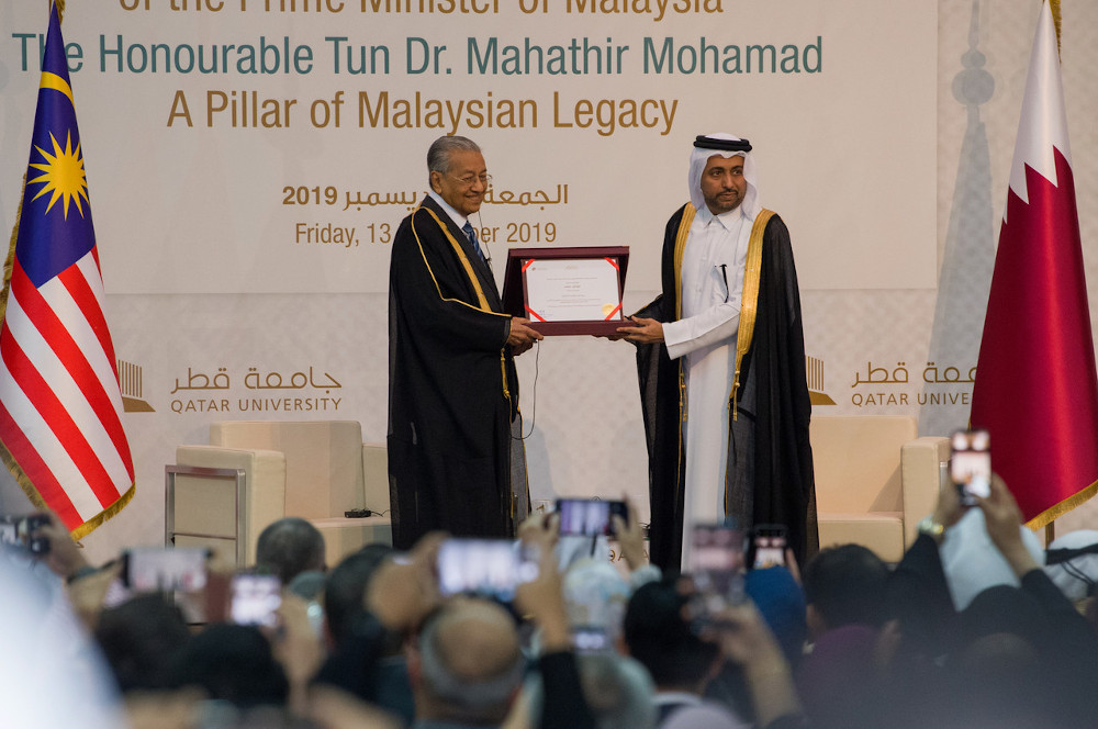 Malaysian Prime Minister Tun Dr Mahathir Mohamad receives the Honorary Doctorate of Philosophy from the President of Qatar University Dr Hassan Al Derham in Doha, December 13, 2019. u00e2u20acu201d Bernama pic