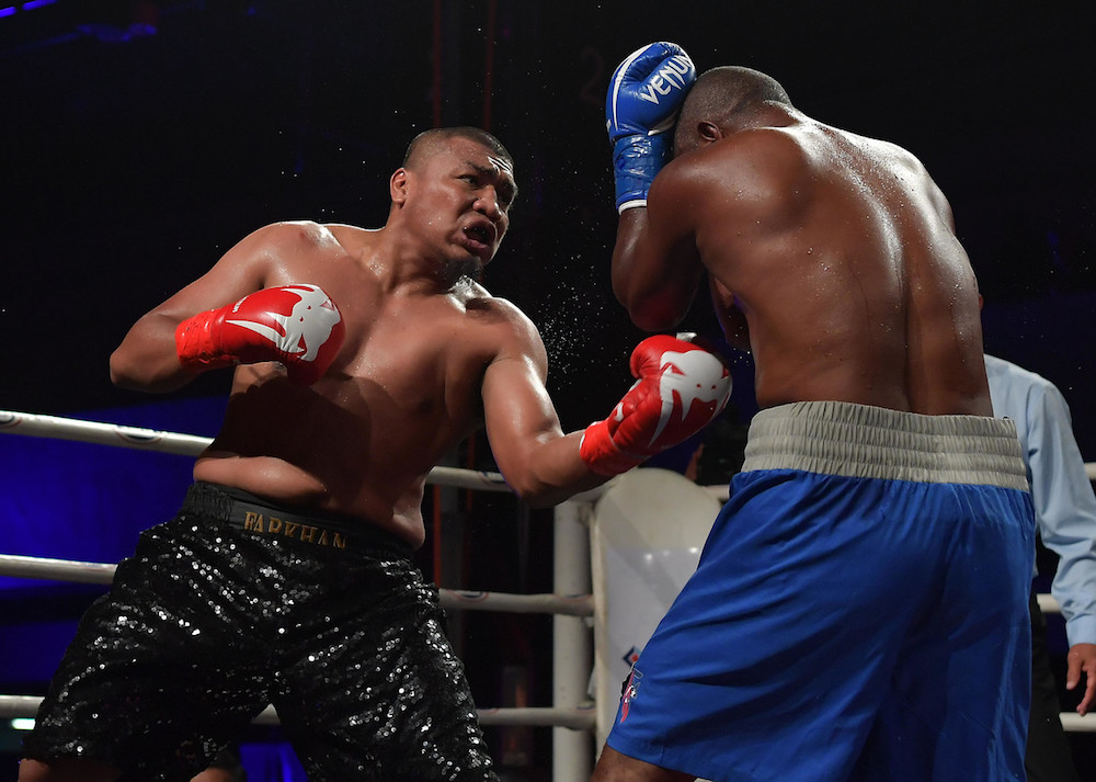 National professional boxer Muhammad Farkhan Haron in action against Pascal Abel Ndomba of Tanzania during the Johor International Boxing Championships 2019 in Johor Baru December 29, 2019. u00e2u20acu201d Bernama pic