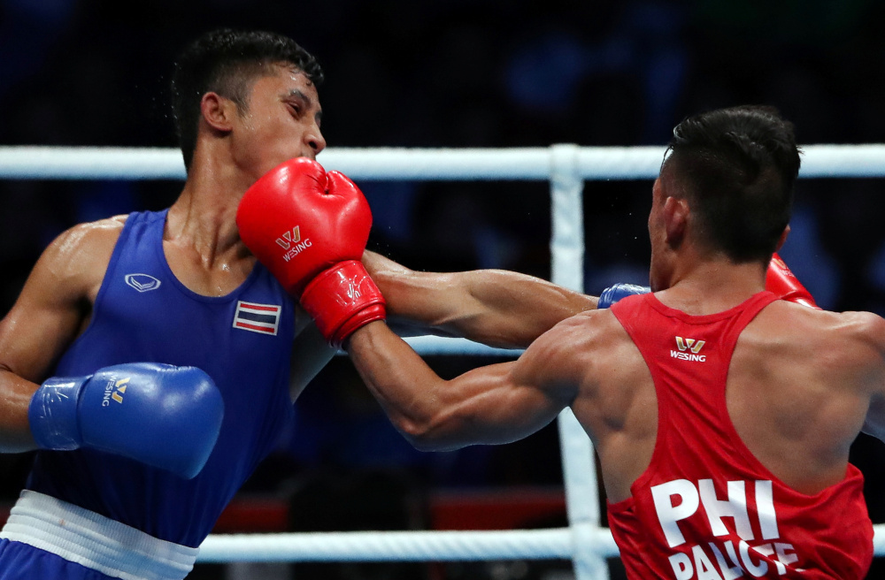 Philippinesu00e2u20acu2122 Palicte James in action against Thailandu00e2u20acu2122s Phoemsap Atichai in the Menu00e2u20acu2122s Light Welterweight (64kg) semi-final at Picc Forum, Pasay, Philippines December 8, 2019. u00e2u20acu201d Reuters pic 