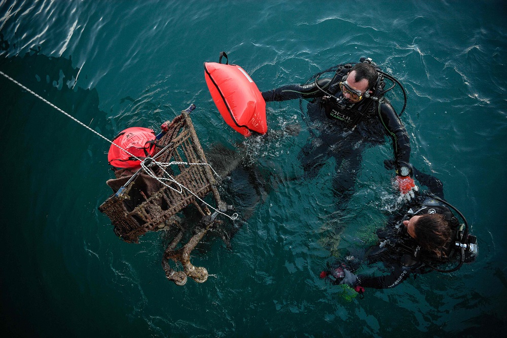 Divers volunteering for the Aegean Rebreath Greek organisation retrieve rusted shopping carts from the sea in the port of the Ionian island of Zakynthos November 23, 2019. u00e2u20acu201d AFP pic 