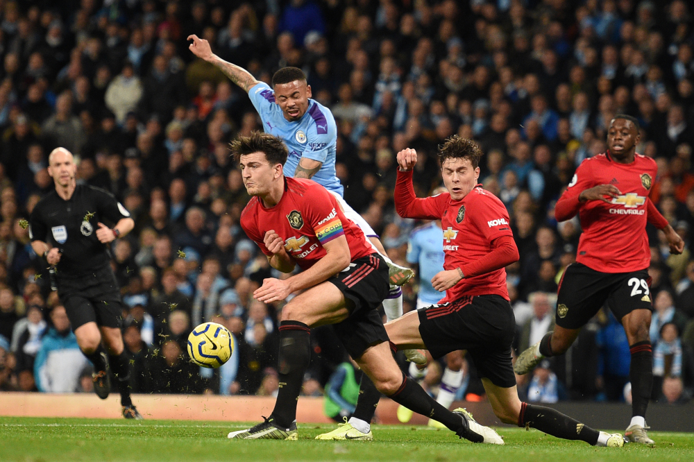 Manchester United defender Harry Maguire and defender Victor Lindelof (2nd right) block a shot from Manchester City striker Gabriel Jesus (2nd left) during the match at Etihad Stadium in Manchester, England, on December 7, 2019. u00e2u20acu201d AFP pic 