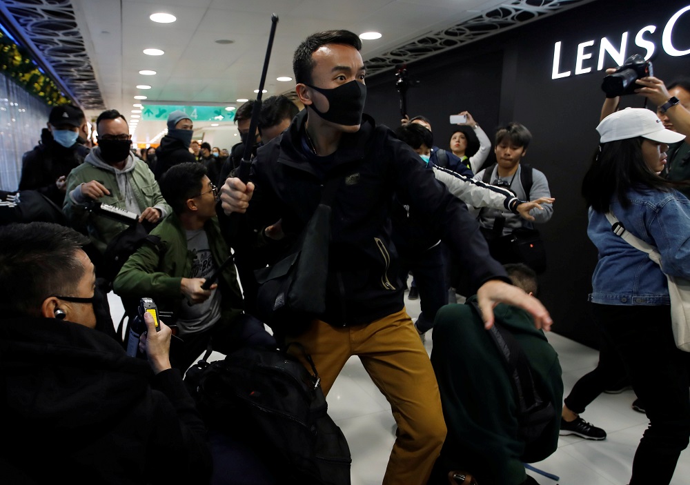 A plain-cloth police officer clash with anti-government protesters inside the Sheung Shui shopping mall in Hong Kong December 28, 2019. u00e2u20acu2022 Reuters pic 