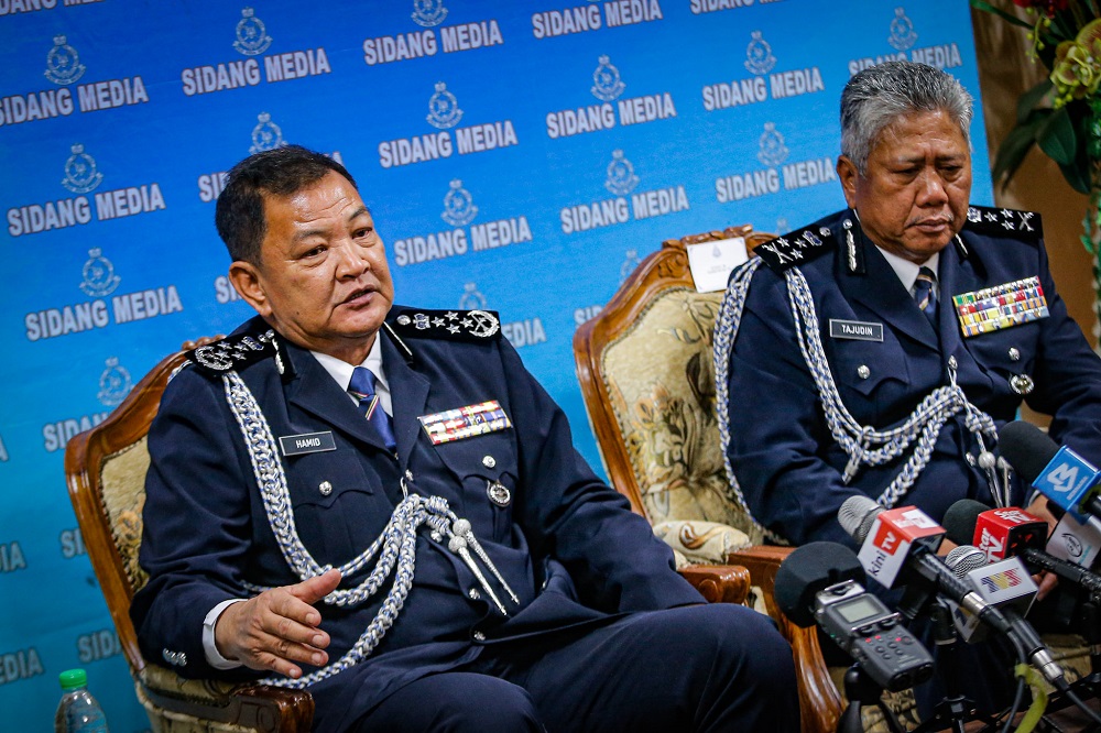 Inspector-General of Police Tan Sri Abdul Hamid Bador (left) together with Datuk Seri Tajudin Md Isa at the Press conference in Police headquarters Bukit Aman Kuala Lumpur December 23, 2019. u00e2u20acu2022 Picture by Hari Anggara