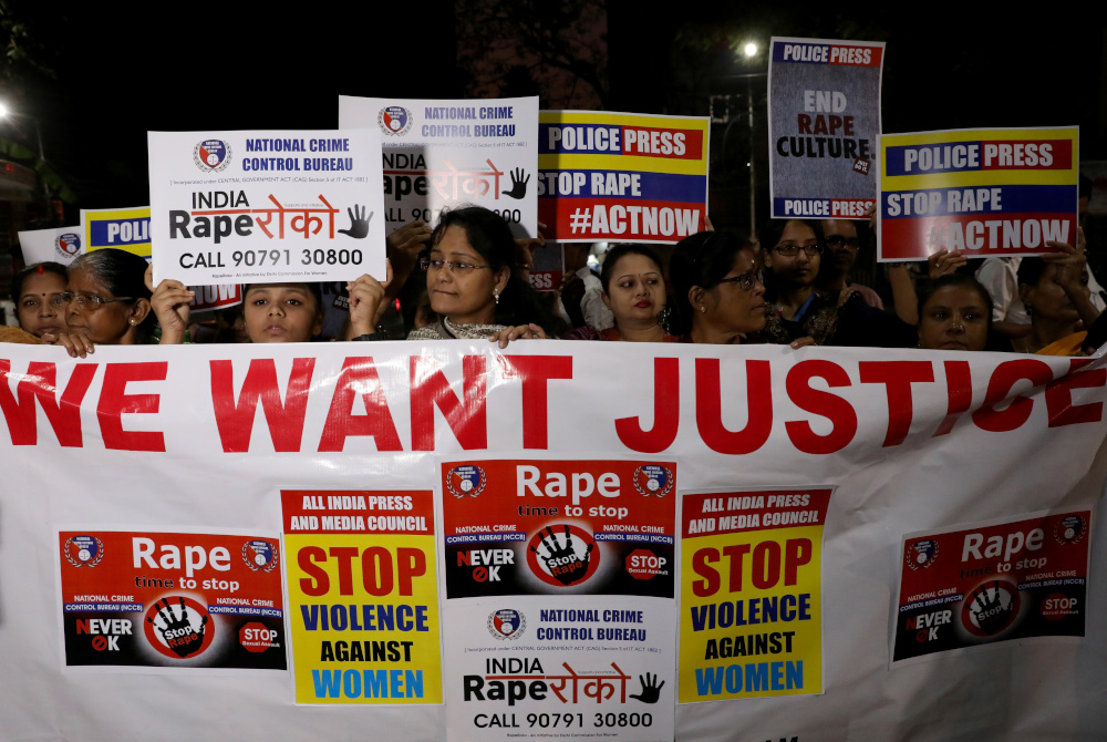 Women display a banner and placards as they attend a protest march against the alleged rape and murder of a 27-year-old woman, in Kolkata, India, December 4, 2019. u00e2u20acu201d Reuters pic  