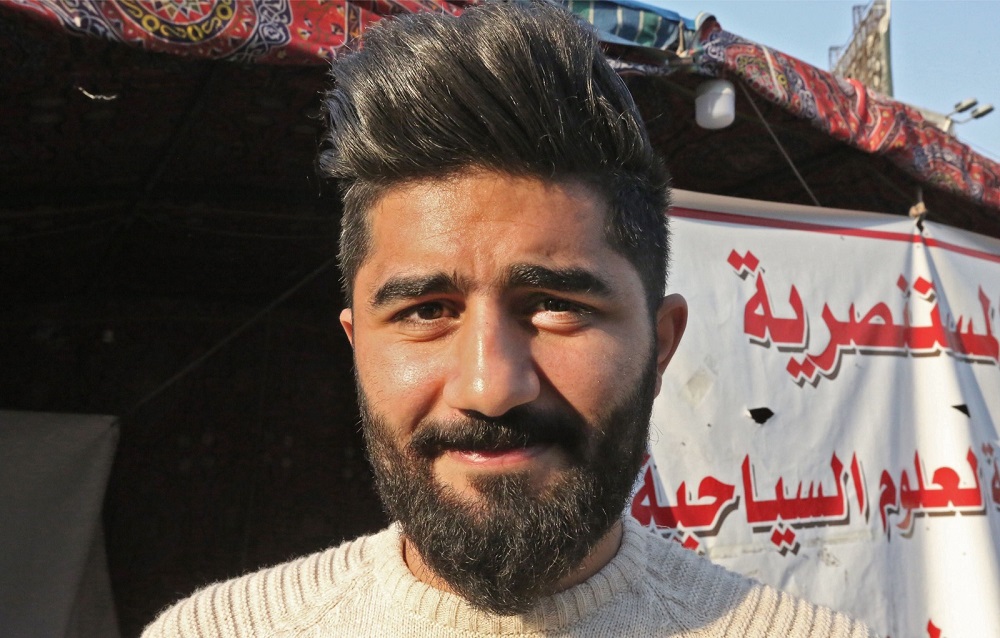 An Iraqi anti-government demonstrator sporting a pompadour hairstyle poses at Tahrir Square in central Baghdad December 23, 2019. u00e2u20acu201d AFP pic