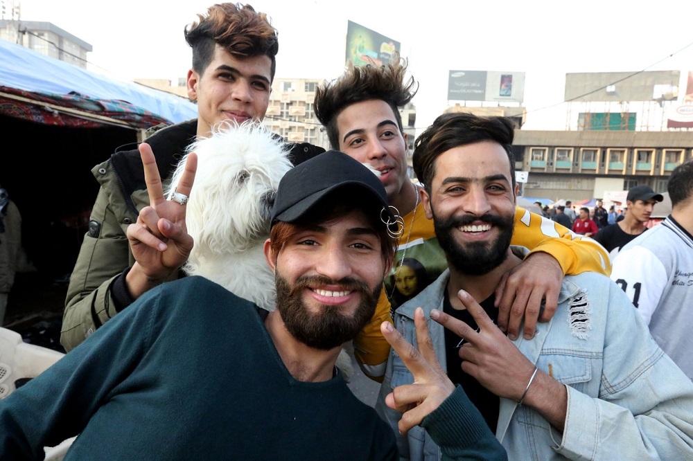 Iraqi anti-government demonstrators sporting a pompadour hairstyle pose at Tahrir Square in central Baghdad December 23, 2019. — AFP pic