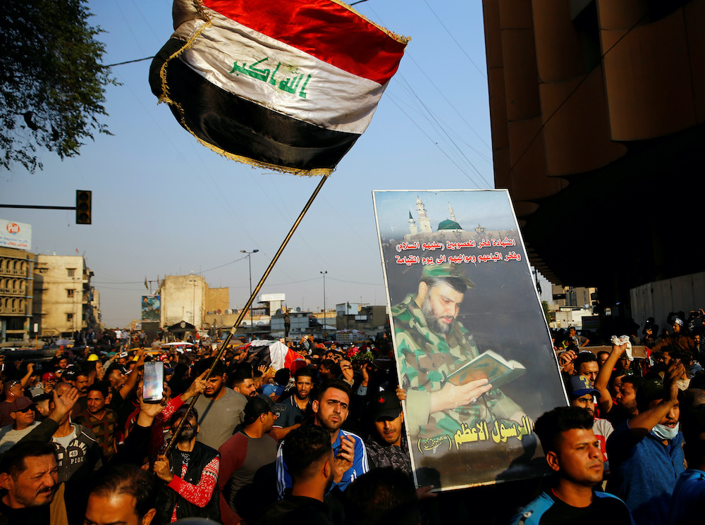 Mourners carry a coffin of a demonstrator who was killed at an anti-government protest, while others carry an Iraqi flag and a picture of Iraqi Shiu00e2u20acu2122ite cleric Moqtada al-Sadr during the funeral in Baghdad, Iraq November 26, 2019. u00e2u20acu201d Reuters pic