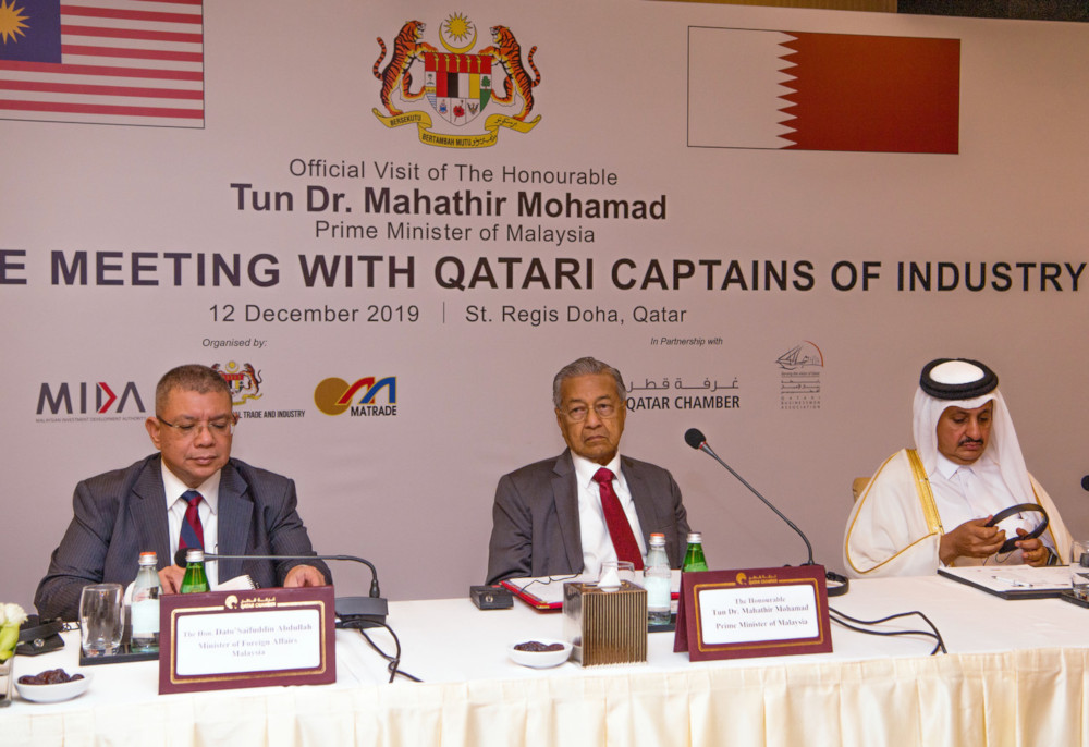 Prime Minister Tun Dr Mahathir Mohamad with Foreign Minister Datuk Saifuddin Abdullah and Qatar Chamber of Commerce Chairman Sheikh Khalifa Jassim Al-Thani (right) during a Roundtable Meeting With Qatari captains of industry December 12, 2019. u00e2u20acu201d Bernama