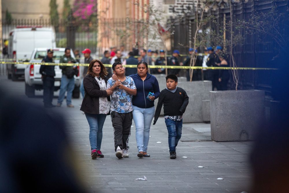 People react at a crime scene where four people were killed and two injured in a shooting near Mexicou00e2u20acu2122s National Palace, in Mexico City, Mexico December 7, 2019. u00e2u20acu201d Reuters pic
