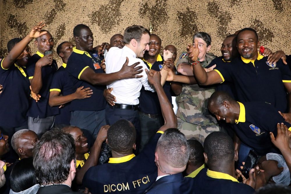 French President Emmanuel Macron celebrates his 42nd birthday with French soldiers during a Christmas dinner with French troops at the Port-Bouet military camp near Abidjan on December 21, 2019, during his three day visit to West Africa. u00e2u20acu201d AFP pic