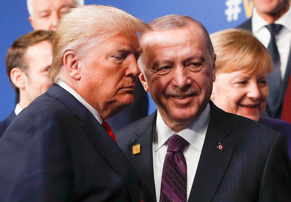 US President Donald Trump and Turkey's President Recep Tayyip Erdogan leave the stage after the family photo to head to the plenary session at the Nato summit at the Grove hotel in Watford, north-east of London December 4, 2019. u00e2u20acu201d AFP pic 