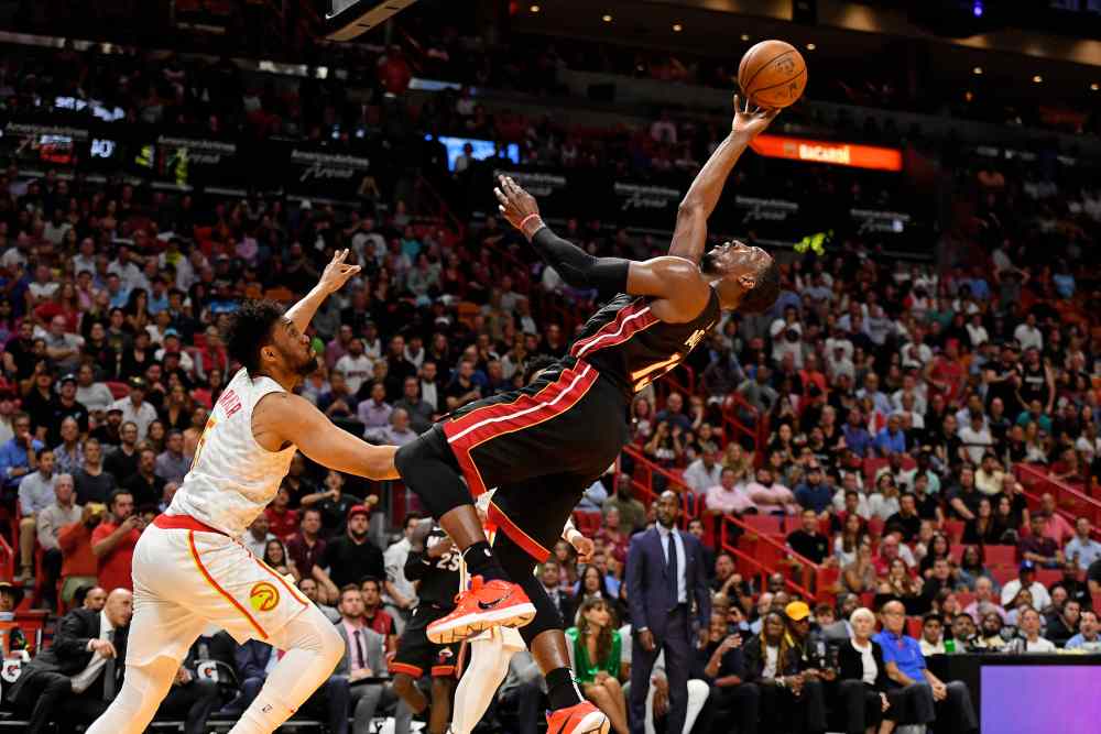 Miami Heat centre Bam Adebayo (13) shoots the ball after being fouled by Atlanta Hawks forward Jabari Parker (5) during the second half at American Airlines Arena. u00e2u20acu2022 Jasen Vinlove-USA TODAY Sports via Reuters