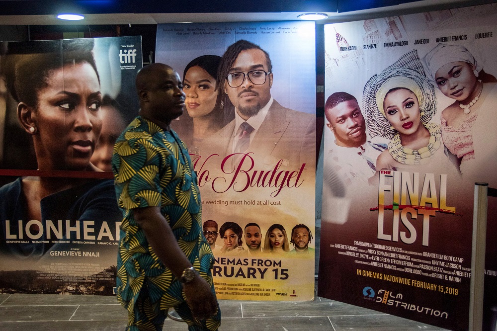 A man passes by Nigerian movie billboards at a cinema in Lagos on February 19, 2019. u00e2u20acu201d AFP pic 