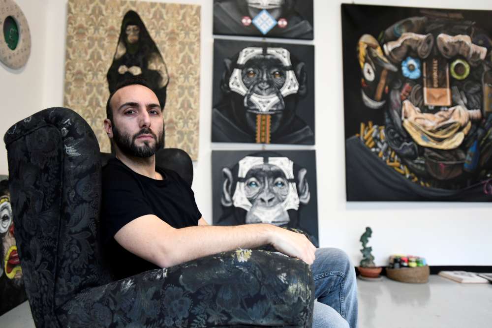 Italian artist Simone Fugazzotto, who designed an anti-racism artwork featuring three side-by-side paintings of apes that was presented by Italian football league Serie A, poses for a photograph in Milan December 17, 2019. u00e2u20acu2022 Reuters pic