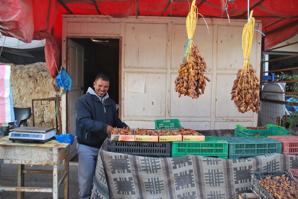 Lazhar Ghiloufi sells his dates at a market in the centre of Kebili, south Tunisia December 2, 2019. u00e2u20acu201d Thomson Reuters Foundation pic