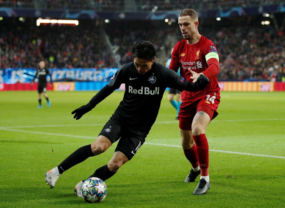 FC Salzburg's Takumi Minamino in action with Liverpool's Jordan Henderson at the Red Bull Arena in Salzburg December 10, 2019. u00e2u20acu201d Reuters pic