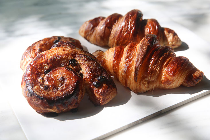 Don't miss out on their raisin rolls (left) and the excellent sourdough croissants that can be found at Three Little Birds in Desa Parkcity