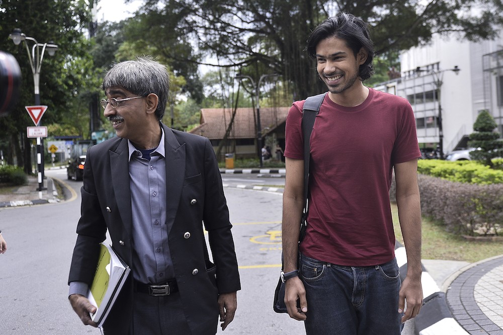 Muhammed Yusoff Rawther and his lawyer, Mohamed Haniff Khatri Abdulla, arrive at Bukit Aman police headquarters in Kuala Lumpur December 17, 2019. u00e2u20acu201d Picture by Miera Zulyana