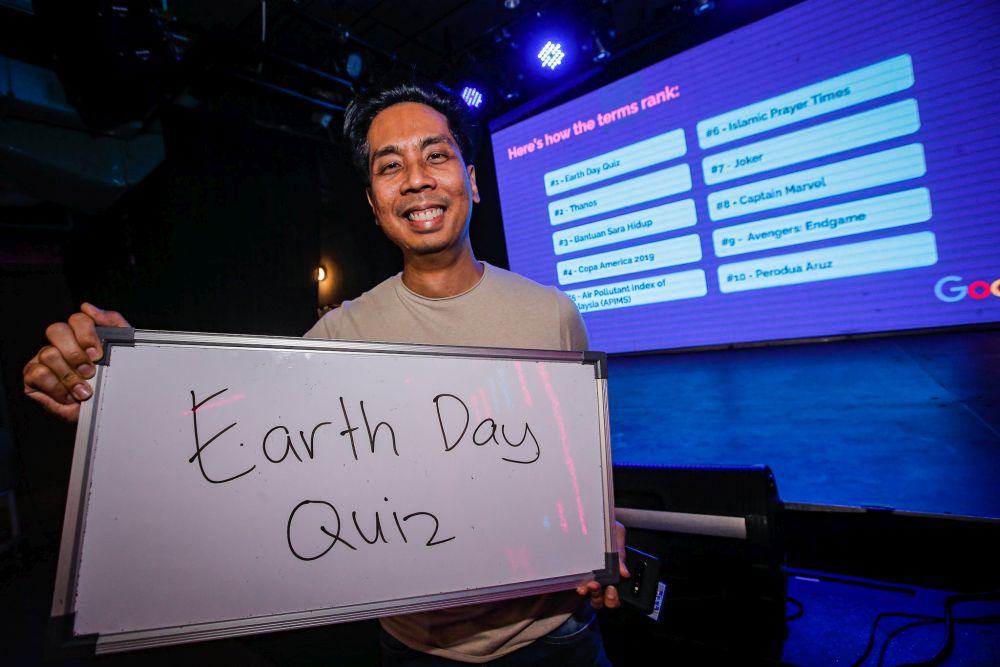 Google Malaysiau00e2u20acu2122s head of communications Zeffri Yusof holds up a whiteboard with the words u00e2u20acu02dcEarth Day Quizu00e2u20acu2122, the most-searched term in Malaysia this year, during a Google event at Publika, Kuala Lumpur December 11, 2019. u00e2u20acu201d Picture by Hari Anggaran