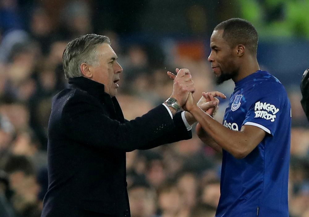 Everton manager Carlo Ancelotti celebrates with Djibril Sidibe after the match against Burnley December 27, 2019. u00e2u20acu2022 Reuters pic
