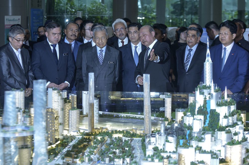 Prime Minister Tun Dr Mahathir Mohamad looks at a scale model of Bandar Malaysia during the signing ceremony between TRX City and IWH CREC in Putrajaya December 17, 2019. u00e2u20acu2022 Picture by Shafwan Zaidon
