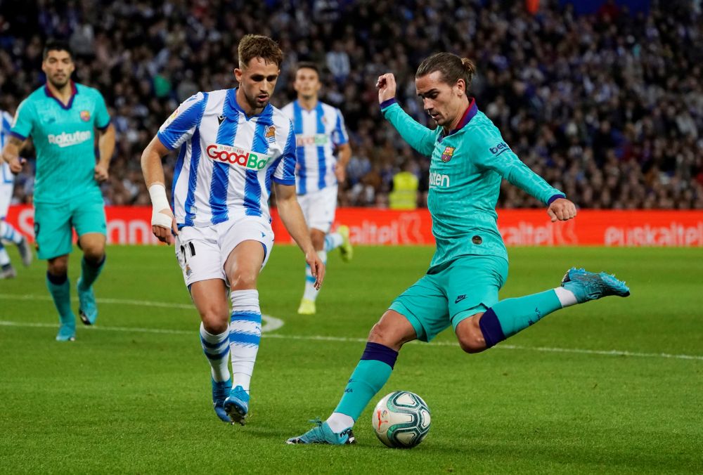 Barcelona's Antoine Griezmann in action with Real Sociedad's Adnan Januzaj at the Anoeta Stadium, San Sebastian December 14, 2019. u00e2u20acu201d Reuters pic