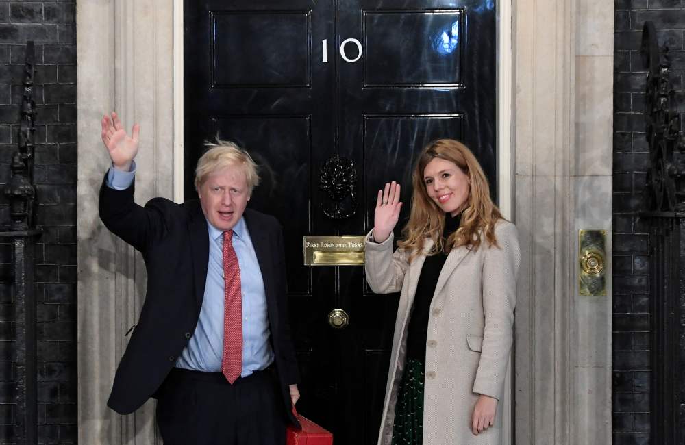 Britain's Prime Minister Boris Johnson and his partner Carrie Symonds gesture as they arrive at 10 Downing Street on the morning after the general election in London December 13, 2019. u00e2u20acu2022 Reuters pic