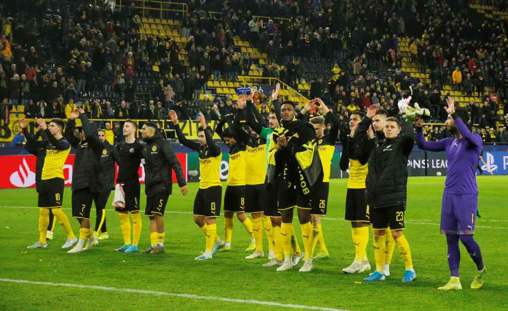 Borussia Dortmund players celebrate at the end of the match against Slavia Prague December 11, 2019. u00e2u20acu2022 Reuters pic