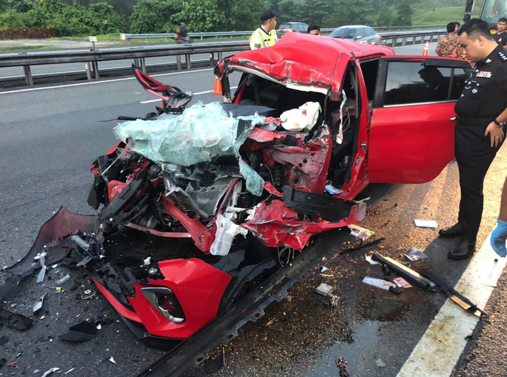 In the incident at about 4.30am, a Perodua Myvi carrying a man and four women crashed into the back of a three-tonne lorry. u00e2u20acu201d Picture via Twitter/Bernamadotcom