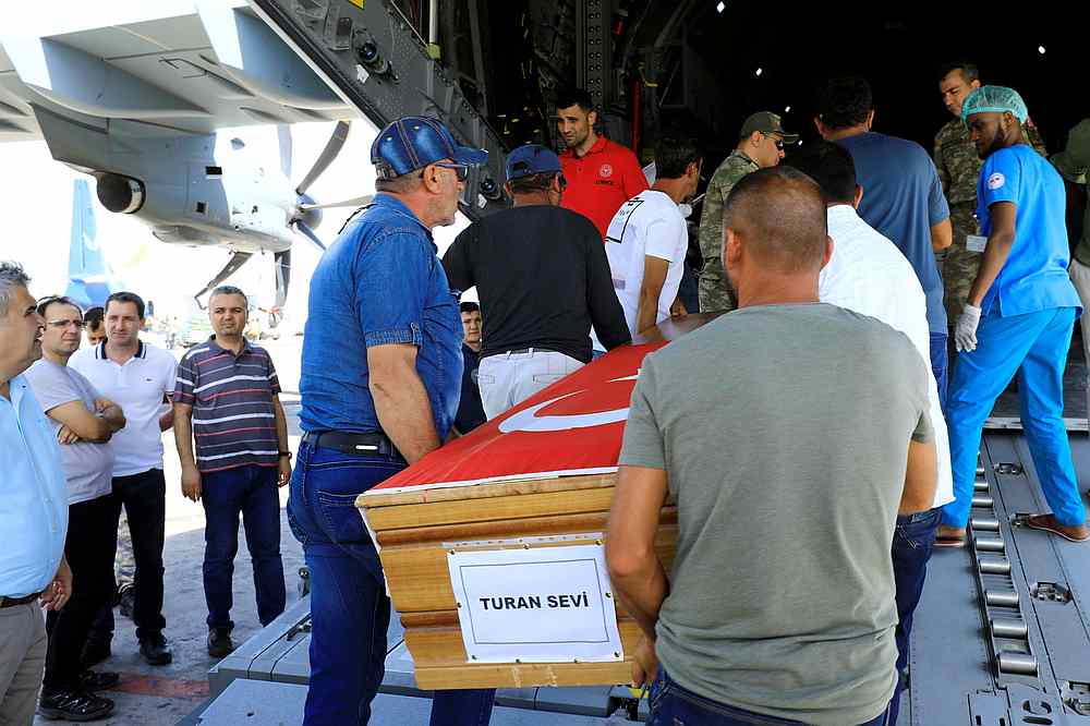Turkish workers carry the coffin of their colleague killed in the car bomb explosion at the Afgoye junction to the airport in Mogadishu, Somalia December 29, 2019. u00e2u20acu201d Reuters pic