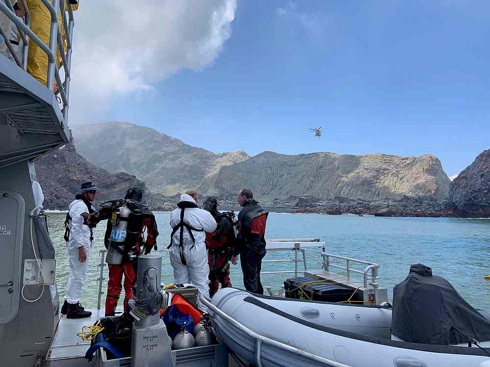 Members of a dive squad conduct a search around White Island, a volcanic island that fatally erupted earlier, in New Zealand, ecember 13, 2019. u00e2u20acu201d New Zealand Police handout via Reuters