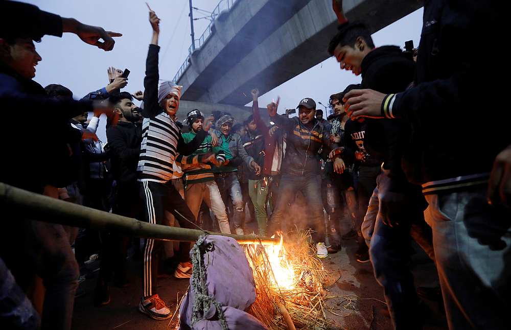 Demonstrators burn an effigy depicting Prime Minister Narendra Modi during a protest against a new citizenship law, outside Jamia Millia Islamia university in New Delhi December 16, 2019. u00e2u20acu201d Reuters pic