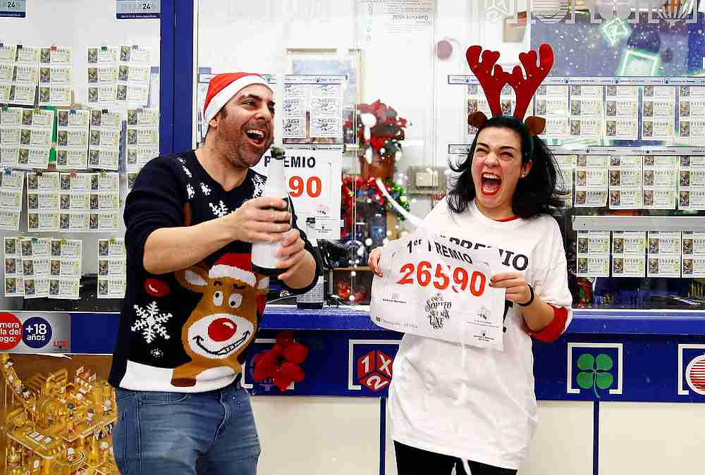 Owner Jose Maria Nogales and his wife Paloma Rodriguez celebrate selling the winning ticket of the biggest prize in Spain's Christmas lottery 'El Gordo' (The Fat One) in Seville December 22, 2019. u00e2u20acu201d Reuters pic
