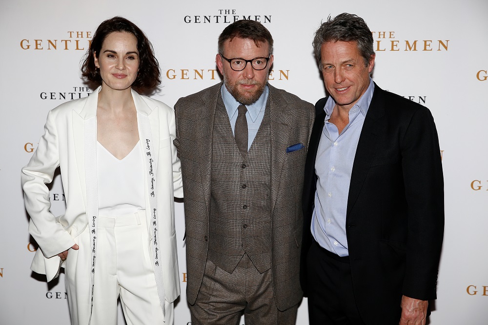 Director Guy Ritchie and actors Michelle Dockery and Hugh Grant pose as they arrive for a special screening of u00e2u20acu02dcThe Gentlemenu00e2u20acu2122 in London, Britain December 3, 2019. u00e2u20acu201d Reuters pic