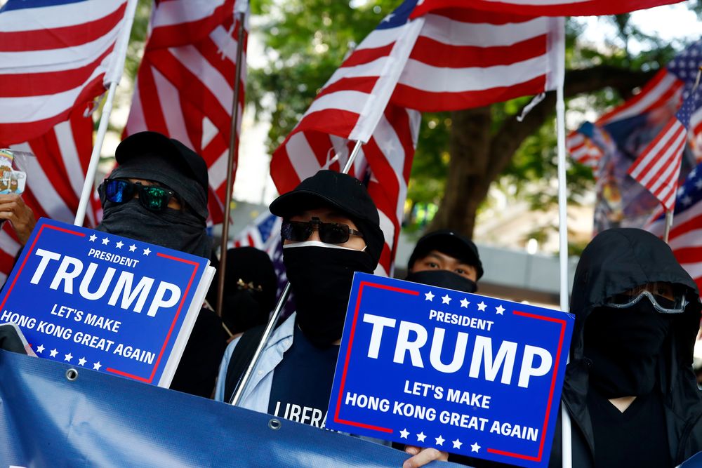 Masked protesters hold placards during the u00e2u20acu02dcMarch of Gratitude to the USu00e2u20acu2122 event in Central, Hong Kong, China December 1, 2019. u00e2u20acu201d Reuters pic