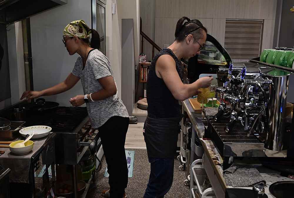 Chow Chung-mingu00efu00bcu015241u00efu00bcu0152 a former computer programmer in Hong Kong and his wife So Kit-sum 48, working at their coffee shop in Kaohsiung, southern Taiwan November 13, 2019. u00e2u20acu201d AFP picn