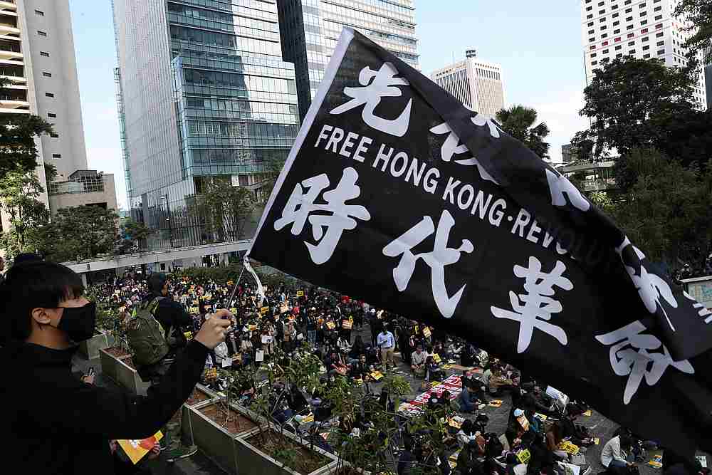 An anti-government demonstrator holds a flag as people gather for a lunchtime protest at Chater Garden in Hong Kong December 2, 2019. u00e2u20acu201d Reuters pic