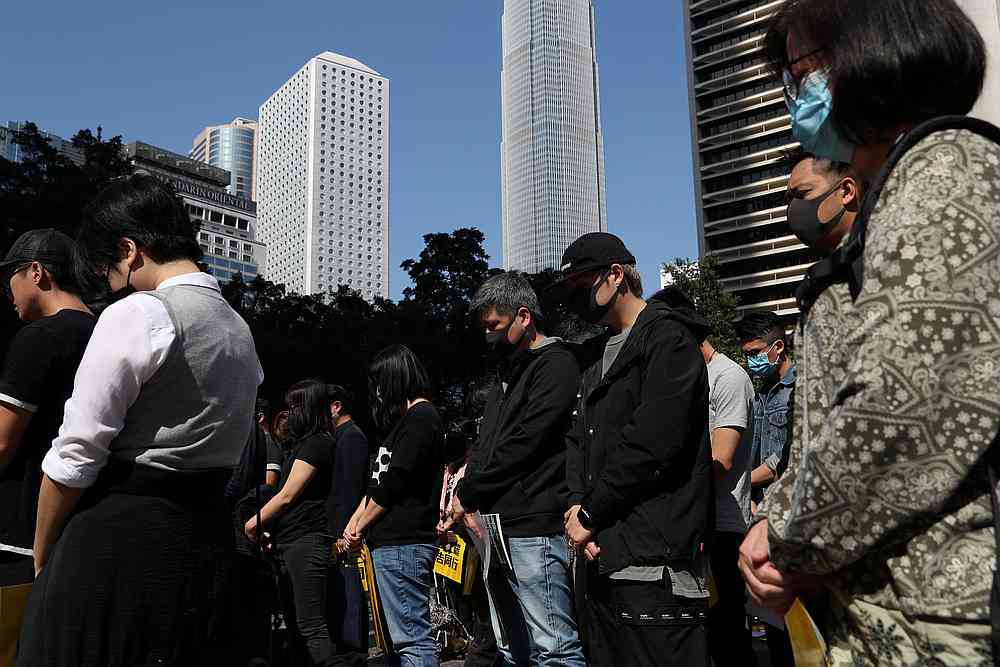 Anti-government demonstrators stand still during a moment of silence as people gather for a lunchtime protest at Chater Garden in Hong Kong December 2, 2019. u00e2u20acu201d Reuters pic