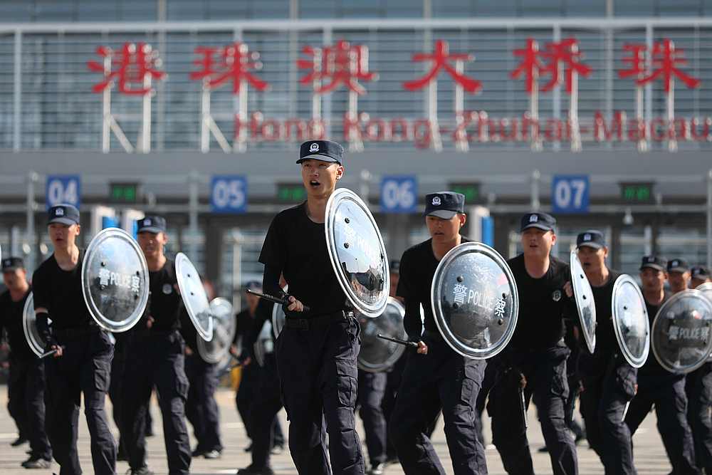 Police officers take part in a drill at the Hong Kong-Zhuhai-Macau Bridge Zhuhai Port in the South Chinese province of Guangdong November 29, 2019. u00e2u20acu201d Reuters pic