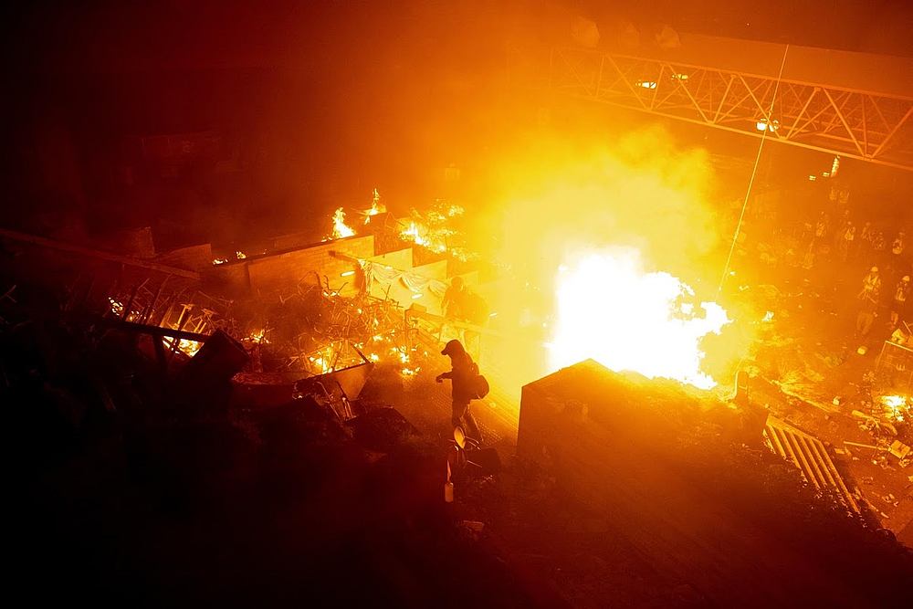 A protester holds a bow and arrow during clashes with police outside Hong Kong Polytechnic University (PolyU).  u00e2u20acu201d Reuters pic