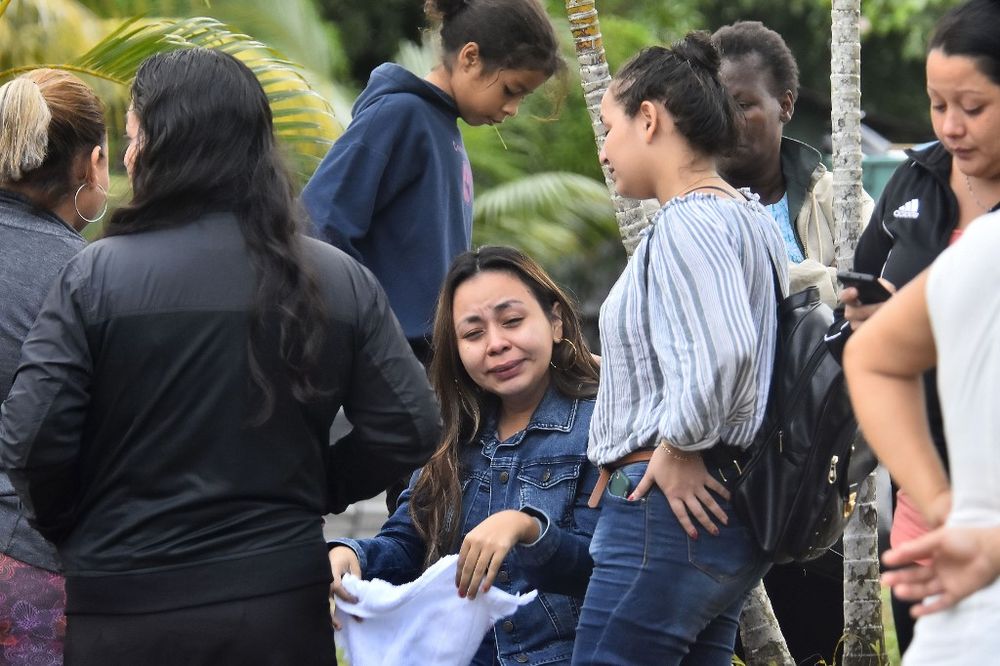 Relatives of inmates react after getting information about their loved ones in front of the penitentiary of Tela, Atlantida department, Honduras, on December 21, 2019. u00e2u20acu201d AFP pic