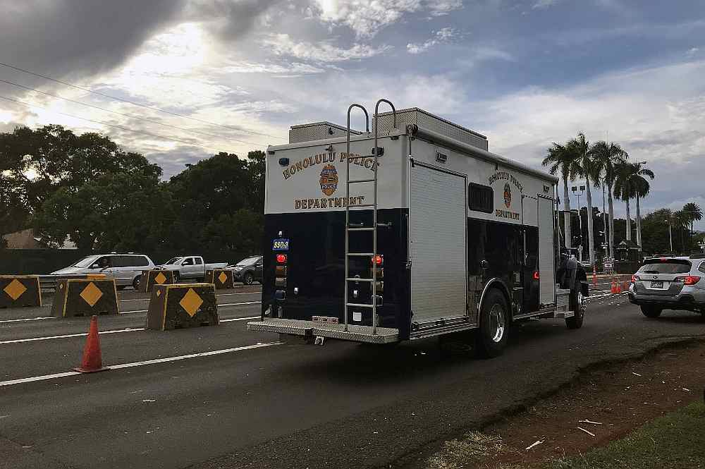A Honolulu police vehicle enters the Nimitz Gate entrance to the Pearl Harbor Naval Shipyard to assist with a fatal shooting incident, in Honolulu, Hawaii December 4, 2019. u00e2u20acu201d AFP pic