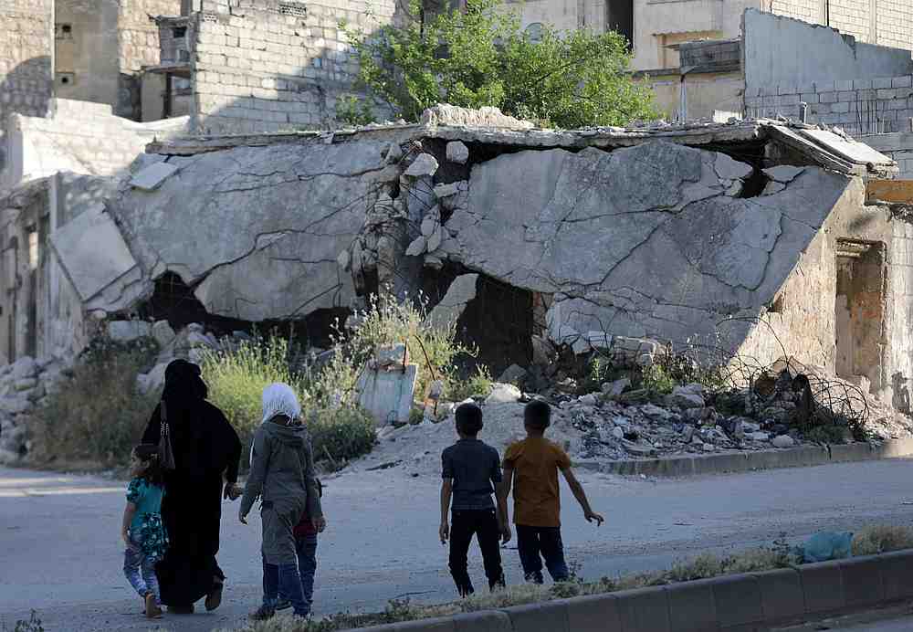People walk near rubble of damaged buildings in the city of Idlib, Syria May 27, 2019. u00e2u20acu201d Reuters pic