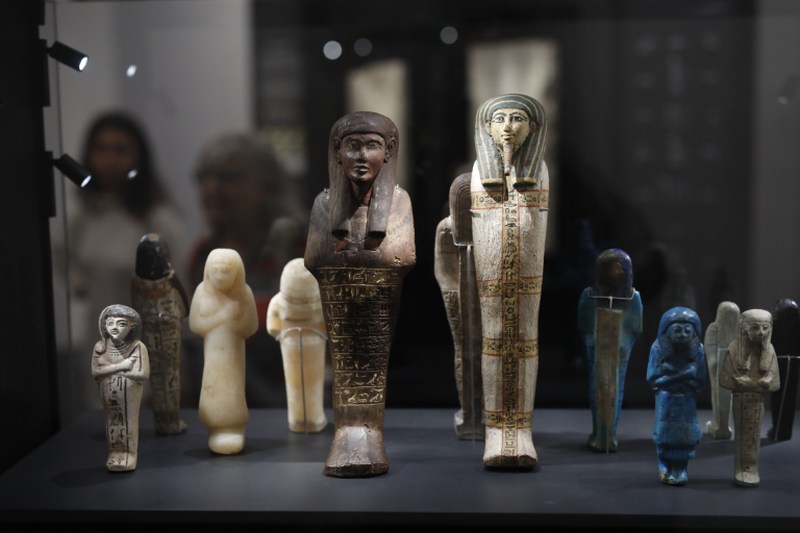 A visitor looks at ancient Egyptian statues bearing Hieroglyphs at the Israel Museum in Jerusalem. u00e2u20acu2022 AFP pic